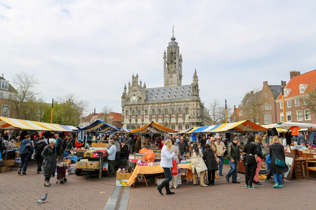 MIDDELBURG, THE NETHERLANDS - APRIL 12, 2014:  Antique market in front of the famous Town Hall of the city of Middelburg, capital of Zeeland province, the Netherlands.のeditorial素材