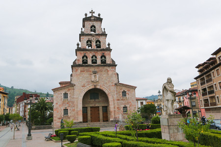 VILLAVICIOSA, SPAIN - JULY 16, 2014: Church tower and statue of Pelayo, first king of Spain, in Villaviciosa, Asturias, Spain, a town famous for its Sidra Natural.のeditorial素材