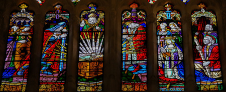 OVIEDO, SPAIN - JULY 17, 2014:  Stained glass window depicting famous historical figures (including El Cid, his wife Jimena Diaz and King Alfonso VI) in the cathedral of San Salvador in Oviedo, Asturias, Spain.のeditorial素材