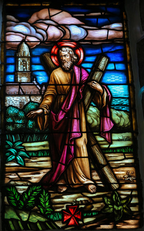SAN ANDRES DE TEXEIDO, SPAIN - JULY 17, 2014: Stained glass window depicting Saint Andrew in the church of San Andres de Texeido, a famous Galician pilgrimage place in the Rias Altas region.のeditorial素材