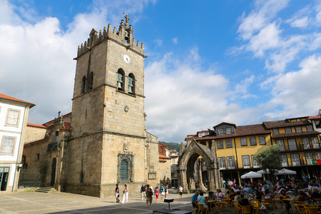 GUIMARAES, PORTUGAL - AUGUST 7, 2014: Oliveira Square with Nossa Senhora da Oliveira Church and Salado Monument in Guimaraes, Portugal.のeditorial素材