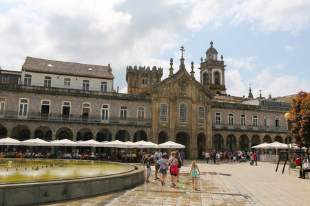 BRAGA, PORTUGAL - AUGUST 9, 2014:  Remnants of the Castle of Braga, the Keep Tower,  and other historic buildings at the Avenida Central  in Braga, Portugal.のeditorial素材