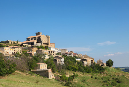 Panorama on the town and 12th Century fortified church of Santa Maria in Ujue, (Uxue in Basque), a town in Navarre, Northern Spain.のeditorial素材