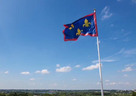 Fleurs-de-lis or Lilly flag at Angers, once capital of Anjou, in Marne-et-Loire, France. This flag was once the flag of France.の写真素材
