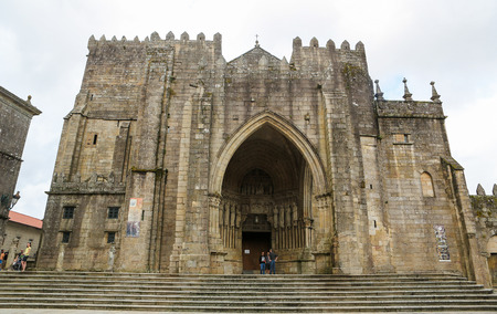 TUI, SPAIN - AUGUST 2, 2014: Facade with entrance portal of the Romanesque Cathedral (11th-13th Century) of Saint Mary of Tui, Galicia, Spain.のeditorial素材