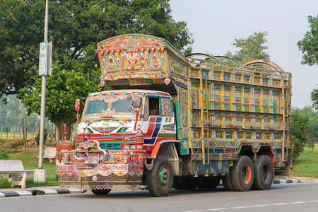 JAIPUR, INDIA - SEPTEMBER 27, 2008: Colorful Indian truck on a highway near Jaipur, Rajasthan, Indiaのeditorial素材