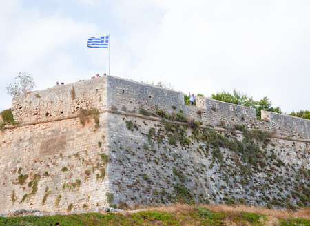 RETHIMNO, GREECE - OCTOBER 3, 2014: Greek Flag at the Venetian Fortezza or Citadel in the city of Rethymno on the island of Crete, Greece, created in 1573.のeditorial素材