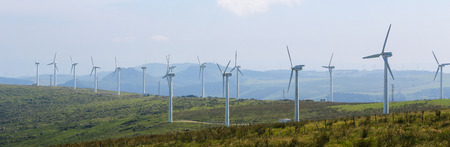 ORTIGUEIRA, SPAIN - JULY 23, 2014: Panorama of a wind turbine farm in the Northern part of Galicia, Spain.のeditorial素材
