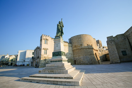 Statue for the heroes and martyrs of Otranto, who were killed during the Ottoman invasion of 1480, and Castello of Otranto, Lecce province, Puglia, Italy. This statue was created more than 100 years ago, no property release is required.の写真素材