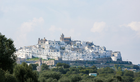 View on the medieval old town of Ostuni in Puglia, South Italy.The center of Ostuni is known as the White Town or La Citta Bianca and a famous site in Italy.の写真素材
