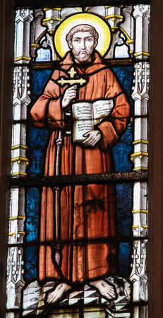 STABROEK, BELGIUM - JUNE 27, 2015: Stained glass window depicting Saint Francis of Asisi in the Church of Stabroek, Belgium.のeditorial素材
