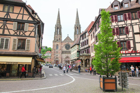 OBERNAI, FRANCE - MAY 8, 2015: Church of St. Peter and St. Paul and historic houses in the center of Obernai, Bas-Rhin, Alsace, Franceのeditorial素材