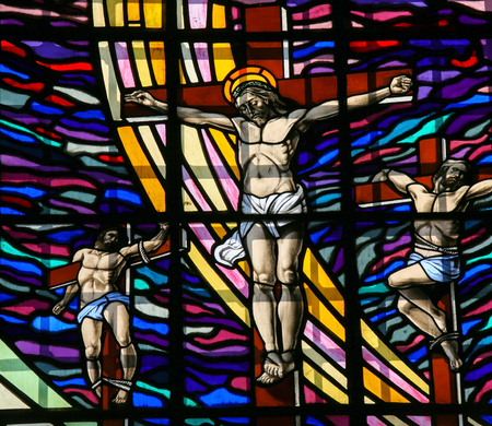 GUIMARAES, PORTUGAL - AUGUST 7, 2014: Stained glass window depicting The Crucifixion of Jesus in the Santos Passos church in Guimaraes, Portugal.のeditorial素材