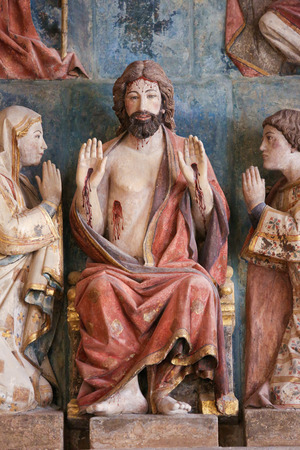 BURGOS, SPAIN - AUGUST 13, 2014: Statue of Jesus Christ enthroned with Mother Mary, a Saint and Angels, in the Cathedral of Burgos, Castille, Spainのeditorial素材