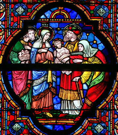 DINANT, BELGIUM - OCTOBER 16, 2011 Stained glass window depicting Joseph and Mary presenting the Child Jesus to Saint Ana and Joachim, in the Notre Dame church in Dinant, Belgiumのeditorial素材