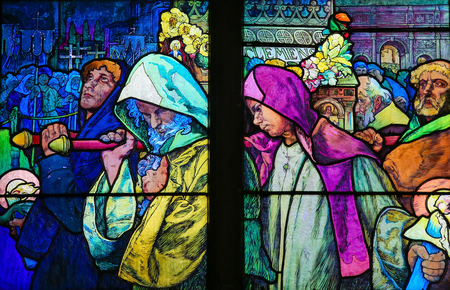 PRAGUE, CZECH REPUBLIC - APRIL 2, 2016: Stained Glass window in St. Vitus Cathedral, Prague, designed by Alphonse Mucha, depicting Saint Methodius carrying the casket of Saint Cyril.のeditorial素材