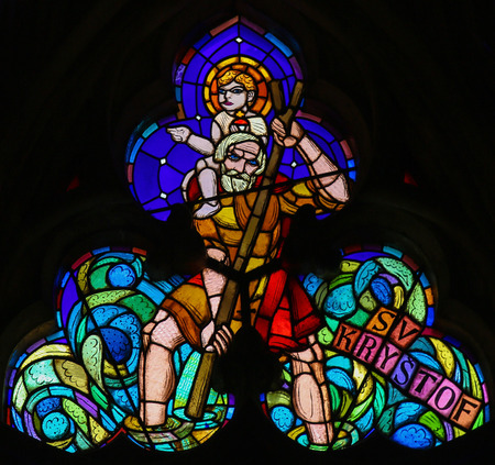 PRAGUE, CZECH REPUBLIC - APRIL 2, 2016: Stained Glass window in St. Vitus Cathedral, Prague, depicting Saint Christopher Carrying the Christ Childのeditorial素材