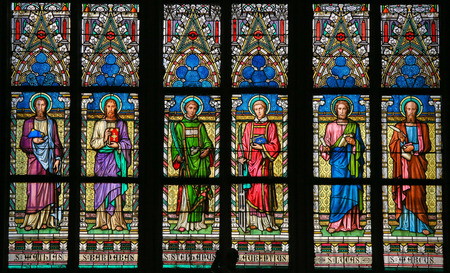PRAGUE, CZECH REPUBLIC - APRIL 2, 2016: Stained Glass window in St. Vitus Cathedral, Prague, depicting various Roman Catholic Saintsのeditorial素材