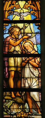 LIER, BELGIUM - MAY 16, 2015: Stained Glass window (1860) in St Gummarus Church in Lier, Belgium, depicting the Baptism of Jesus by Saint John in the River Jordanのeditorial素材