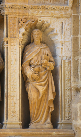 Statue of Saint John the Apostle, depicted with a chalice and a snake, part of the 16th Century Principal Gate at the Church of Santo Tomas in Haro, La Rioja, Spainのeditorial素材