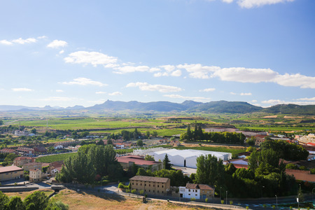 View on the famous bodegas or wine houses and vineyards of the Rioja Alta wine region near Haro, La...