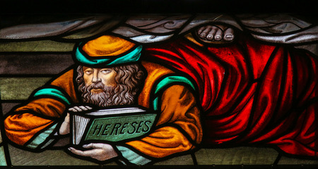 Stained Glass window depicting a heretic, in the Cathedral of Saint Rumbold in Mechelen, Belgium.の写真素材