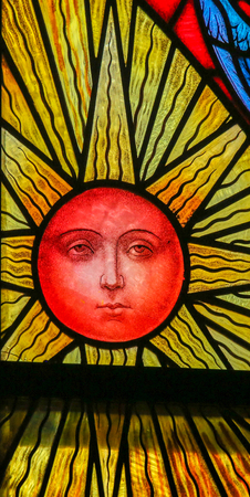Stained Glass window depicting a Sun, in the Cathedral of Saint Rumbold in Mechelen, Belgium.のeditorial素材