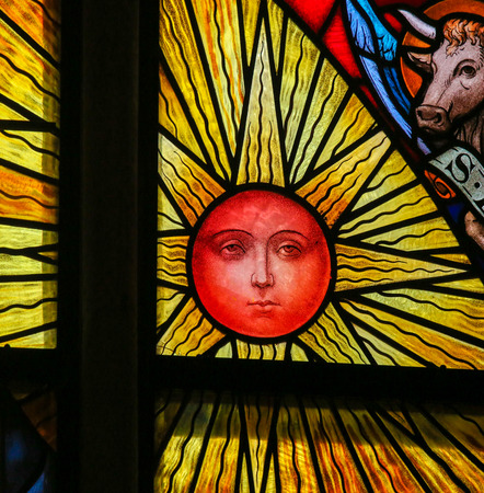 Stained Glass window depicting a Sun, in the Cathedral of Saint Rumbold in Mechelen, Belgium.