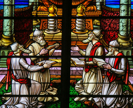 Stained Glass window depicting four Rabbis reading the Torah scrolls, in the Cathedral of Saint Rumbold in Mechelen, Belgium.のeditorial素材