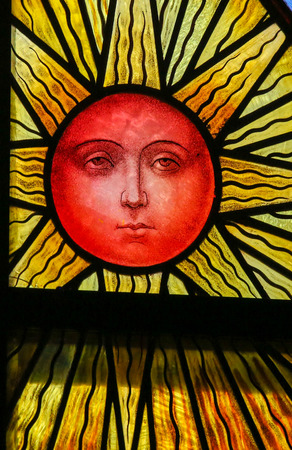 Stained Glass window depicting a Sun, in the Cathedral of Saint Rumbold in Mechelen, Belgium.のeditorial素材