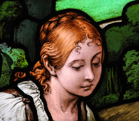 Portrait of a Swedish woman working on a field. Stained glass window in the German Church in Gamla Stan in Stockholm.のeditorial素材