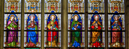 Stained Glass window depicting Catholic Saints in the Cathedral of Saint Bavo in Ghent, Flanders, Belgium.のeditorial素材
