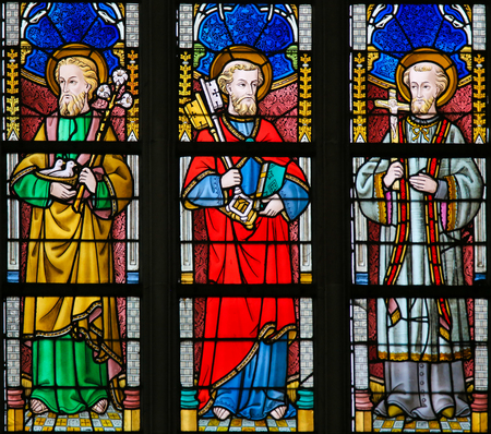 Stained Glass window depicting Saint Joseph, Saint Peter and St Francis Xavier in the Cathedral of Saint Bavo in Ghent, Flanders, Belgium.のeditorial素材