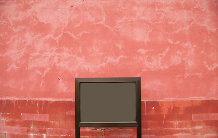Empty sign in front of an ancient red wall in the Forbidden City in Beijing, Chinaの写真素材