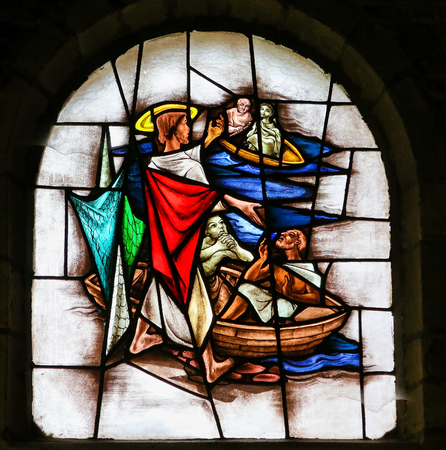 Stained Glass window in the 15th Century Elzenveld Chapel in Antwerp, Belgium, depicting Jesus Calling Four Fishermen to Follow Himのeditorial素材