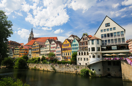 View on houses and the Stiftskirche in the historical center of Tubingen, by the River Neckar in Baden Wurttemberg, Germany.のeditorial素材