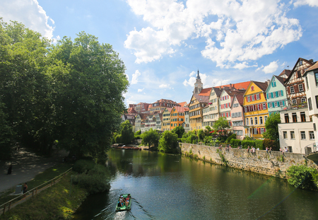 View on houses and the Stiftskirche in the historical center of Tubingen, by the River Neckar in Baden Wurttemberg, Germany.のeditorial素材