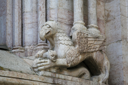 Sculpture of a Griffin at the Cathedral of San Vigilio at the Piazza Duomo in Trento, Trentino, Italyの写真素材