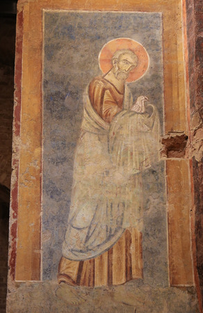 Fresco of a saint with two doves (c.1280) in the crypt of Siena Cathedral, Italyのeditorial素材