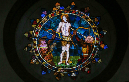 Stained Glass in the Basilica of San Petronio, Bologna, Emilia Romagna, Italy, depicting the Martyrdom of Saint Sebastianのeditorial素材