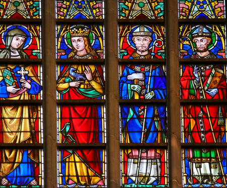 Stained Glass window in the Cathedral of Saint Bavo in Ghent, Flanders, Belgium, depicting Catholic...