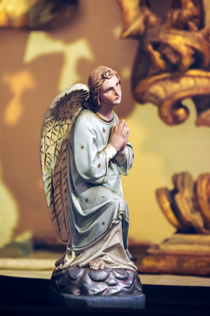 Statue of a Praying Angel in Loreta church, Pragueの写真素材
