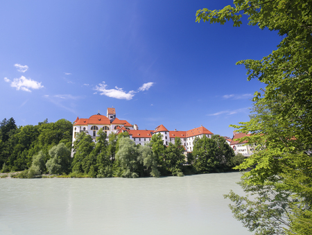 St Mang's Basilica and former monastery viewed from the bridge over the River Lech in Fussen, terminus of the Romantic Road in Bavaria.のeditorial素材