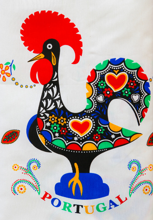 Typical Rooster of Barcelos, a symbol of Portuguese culture and emblem of Portugal, on merchandise in the center of Guimaraes, Portugal.のeditorial素材