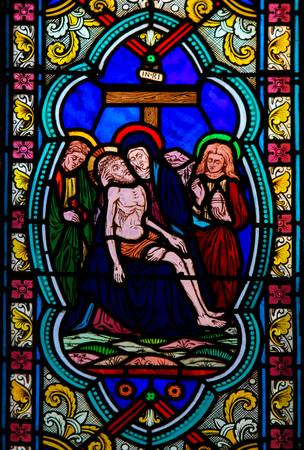 Stained Glass in the Cathedral of Monaco, depicting the Dead Body of Jesus taken from the Cross on the lap of His Mother, the Virgin Maryの写真素材