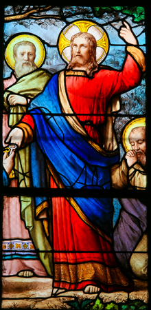Stained Glass in the Church of Saint Severin, Latin Quarter, Paris, France, depicting Jesus handing over the Keys to the Kingdom of Heaven to Saint Peterの写真素材