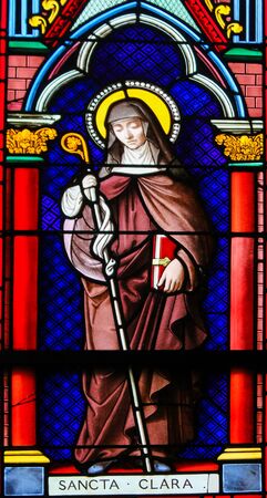 Stained Glass in the Chapel of Notre-Dame-des-flots (1857) in Sainte Adresse, Le Havre, France, depicting Saint Clare, an Italian saint and one of the first followers of Saint Francis of Assisiの写真素材