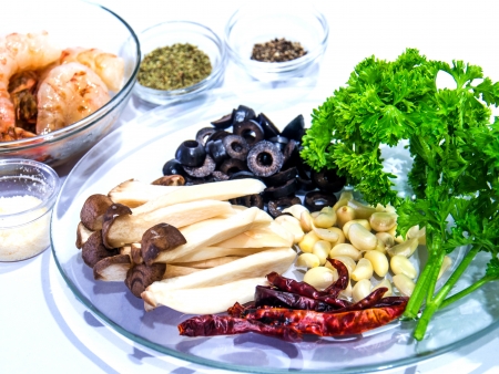 healthy ingredients of Spaghetti black olive pepper with shrimp   Isolatedの写真素材