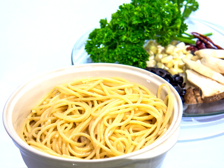 healthy ingredients of Spaghetti black olive pepper with shrimp   Isolatedの写真素材