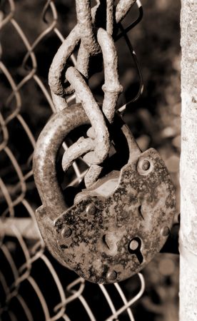 Rusty lock on chainsの写真素材